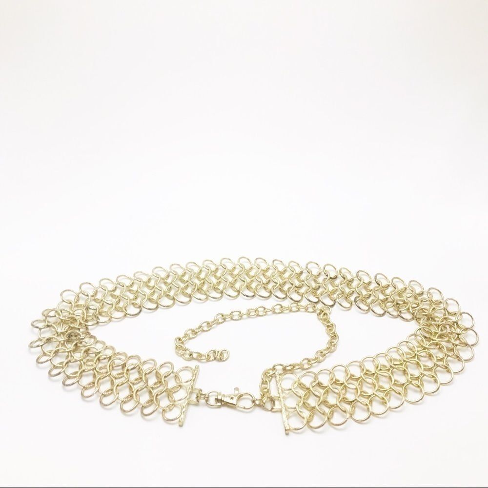 Gold chain-linked waist belt. 
